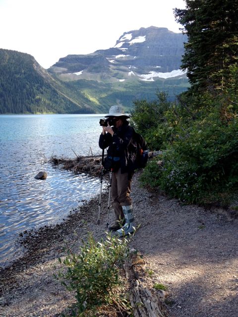 Vickie taking pictures along Cameron Lake